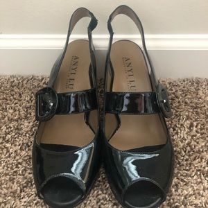 Black patent open toe sling back pump